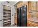 Kitchen features black fridge with in-door water dispenser and pantry storage at 20750 N 87Th St # 2038, Scottsdale, AZ 85255