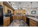 Spacious kitchen featuring granite countertops, tile floor, and modern black appliances at 20750 N 87Th St # 2038, Scottsdale, AZ 85255