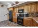 Close up of updated appliances in the kitchen with wooden cabinets and granite countertops at 20750 N 87Th St # 2038, Scottsdale, AZ 85255
