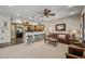 Comfortable living room and kitchen area with barstool seating and granite countertops and new appliances at 20750 N 87Th St # 2038, Scottsdale, AZ 85255
