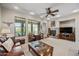 Comfortable living room with large windows, a fireplace, and a relaxing seating arrangement at 20750 N 87Th St # 2038, Scottsdale, AZ 85255