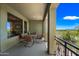 Covered outdoor patio with dining table overlooking a beautiful view with blue skies at 20750 N 87Th St # 2038, Scottsdale, AZ 85255