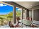 Open patio provides a view of the lush green golf course with expansive blue sky and mountains at 20750 N 87Th St # 2038, Scottsdale, AZ 85255