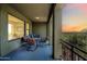 Relaxing covered patio with a table and chairs, offering serene views of the mountains at 20750 N 87Th St # 2038, Scottsdale, AZ 85255