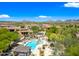 Beautiful pool area with lounge chairs, pergola, and mountain views at 20750 N 87Th St # 2038, Scottsdale, AZ 85255