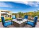 Cozy backyard with a fire pit surrounded by comfortable seating, perfect for outdoor gatherings and relaxation at 21127 W Minnezona Ave, Buckeye, AZ 85396