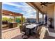 Expansive outdoor space with a covered dining area, outdoor kitchen, and cozy fire pit lounge at 21127 W Minnezona Ave, Buckeye, AZ 85396