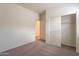 Neutral bedroom with carpet flooring and sliding door closet at 2205 S 241St Dr, Buckeye, AZ 85326