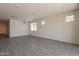 Spacious living area with ample natural light and tile flooring. Fixtures ready for your own personal touch at 2205 S 241St Dr, Buckeye, AZ 85326