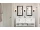 Well-lit bathroom with a double sink vanity, modern fixtures, and ample storage, perfect for a luxurious experience at 2381 W Los Arboles Pl, Chandler, AZ 85224