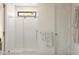 Modern bathroom features a glass-enclosed shower with white tiles and a sleek towel rack at 2381 W Los Arboles Pl, Chandler, AZ 85224