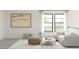 Cozy living space with a comfortable sofa, neutral rug, and large windows for plenty of natural light at 2381 W Los Arboles Pl, Chandler, AZ 85224