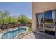 This balcony overlooks a pool and features an exterior view of the home's design at 2405 W Cordia Ln, Phoenix, AZ 85085