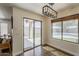 Bright dining area with sliding door access to patio and outdoor view at 2405 W Cordia Ln, Phoenix, AZ 85085