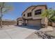 Charming two-story home with a stone-accented entrance and a spacious driveway at 2405 W Cordia Ln, Phoenix, AZ 85085