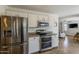 Modern kitchen boasts stainless steel appliances and a refrigerator with water dispenser at 2405 W Cordia Ln, Phoenix, AZ 85085