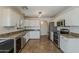 Well-equipped kitchen features stainless steel appliances and granite countertops at 2405 W Cordia Ln, Phoenix, AZ 85085