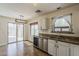 Bright eat-in kitchen features stainless appliances and access to the outdoor patio at 2405 W Cordia Ln, Phoenix, AZ 85085
