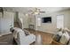 Inviting living room features tile floors, neutral tones, a staircase, and ample natural light at 2405 W Cordia Ln, Phoenix, AZ 85085