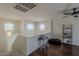 This loft features a seating area, two picture windows, and mixed flooring at 2405 W Cordia Ln, Phoenix, AZ 85085