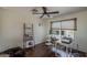 This office features a computer setup, dark wood floors, and a ceiling fan at 2405 W Cordia Ln, Phoenix, AZ 85085