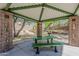 Community picnic area featuring a covered shelter, green table and landscaping at 2405 W Cordia Ln, Phoenix, AZ 85085