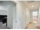 Bright hallway with neutral carpet leads to bathroom, bedroom, and storage closet at 2542 W Gaby Rd, Phoenix, AZ 85041