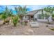 Well-maintained backyard featuring gravel, plants, trees, a covered patio and block wall at 2845 N 104Th Ave, Avondale, AZ 85392