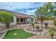 Backyard showcasing mature trees, desert landscaping, pergola, and block fencing at 2845 N 104Th Ave, Avondale, AZ 85392