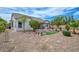 Spacious backyard features decorative rock, mature landscaping, pergola, and privacy fence at 2845 N 104Th Ave, Avondale, AZ 85392