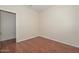 Bedroom with laminate flooring and walk-in closet at 2845 N 104Th Ave, Avondale, AZ 85392