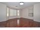 Bedroom with hardwood floors and abundant natural light from multiple windows at 2845 N 104Th Ave, Avondale, AZ 85392