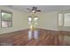 Bright bedroom with hardwood floors and large windows offering natural light at 2845 N 104Th Ave, Avondale, AZ 85392