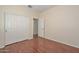 Bedroom with laminate flooring and closet at 2845 N 104Th Ave, Avondale, AZ 85392