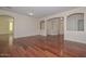 Open living area with stylish hardwood floors and arched doorways at 2845 N 104Th Ave, Avondale, AZ 85392