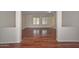 Open-concept living room features beautiful hardwood floors and natural light at 2845 N 104Th Ave, Avondale, AZ 85392