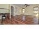 Open-concept living room featuring hardwood floors, and a built-in desk area at 2845 N 104Th Ave, Avondale, AZ 85392
