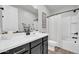 Bathroom featuring a stylish vanity, a tub and shower, and sleek black hardware at 31435 N 130Th Ave, Peoria, AZ 85383
