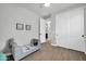 Cozy bedroom with wood-look tile floors, soft decor, and ample natural light at 31435 N 130Th Ave, Peoria, AZ 85383
