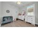 Well-lit Bedroom featuring decor, wood-look tile, and abundant natural light at 31435 N 130Th Ave, Peoria, AZ 85383