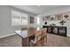 Spacious dining room featuring a wooden table, stylish decor, and access to lots of natural light at 31435 N 130Th Ave, Peoria, AZ 85383