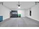 Spacious garage interior with clean concrete floors and ample storage shelving at 31435 N 130Th Ave, Peoria, AZ 85383