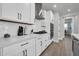 Modern kitchen showcasing sleek white cabinets, stainless steel appliances, and stylish subway tile backsplash at 31435 N 130Th Ave, Peoria, AZ 85383