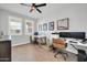 Home office featuring two work stations, great lighting, and wood-look tile flooring at 31435 N 130Th Ave, Peoria, AZ 85383