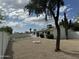 Spacious backyard featuring a fire pit, desert landscaping, and a privacy fence, ideal for relaxing and entertaining at 3225 E Monica Ave, Phoenix, AZ 85032