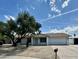 Charming single-story home featuring desert landscaping, mature trees, and a two-car garage in a peaceful neighborhood at 3225 E Monica Ave, Phoenix, AZ 85032