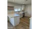 Updated kitchen featuring white cabinets, quartz countertops, stainless steel appliances, and stylish backsplash at 3225 E Monica Ave, Phoenix, AZ 85032