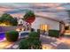 Charming backyard with a pool, manicured hedges, desert landscaping, and a cozy seating area at 3379 E San Pedro Ave, Gilbert, AZ 85234