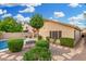 Desert landscaped backyard with a pool and a covered patio at 3379 E San Pedro Ave, Gilbert, AZ 85234