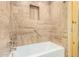 Beautifully tiled bathroom features a built-in shelf and grab bar for accessibility and modern convenience at 3379 E San Pedro Ave, Gilbert, AZ 85234
